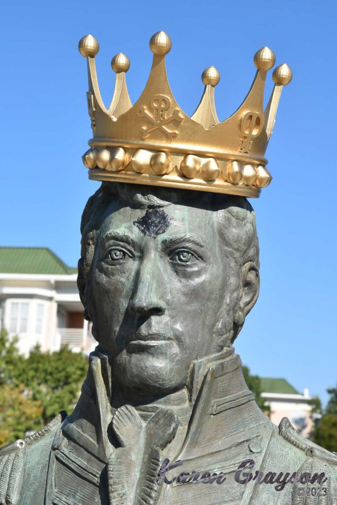 The statue of Commodore Stephen Decatur wearing the Palooza crown. PiratePalooza 19. Photo by Karen Grayson, copyright 2023