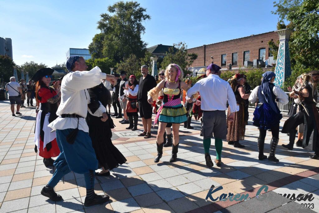 Pirates dancing the Virginia Reel in Decatur. PiratePalooza 19. Photo by Karen Grayson, copyright 2023