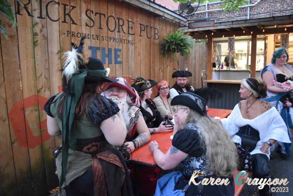 Pirates in the Brick Store Pub garden. PiratePalooza 19. Photo by Karen Grayson, copyright 2023